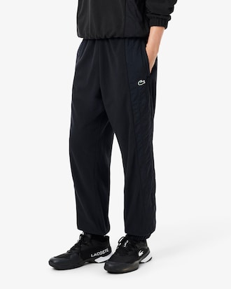 Pantal&oacute;n de ch&aacute;ndal deportivo de dos tejidos