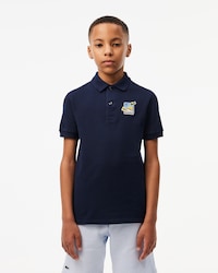 Polo Lacoste × Club Med de piqué con insignia