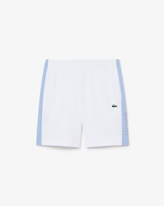 Pantal&oacute;n corto deportivo de tafet&aacute;n diamantado con bloques de color