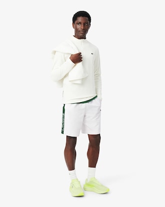 Pantal&oacute;n corto deportivo de tafet&aacute;n diamantado con franja en contraste