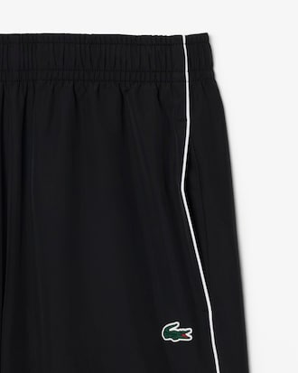 Pantal&oacute;n de ch&aacute;ndal deportivo hidr&oacute;fugo con ribete en contraste