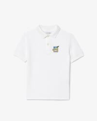 Polo Lacoste × Club Med de piqué con insignia