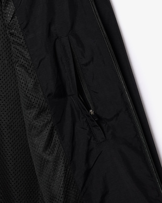 Chaqueta con capucha ligera hidrófuga