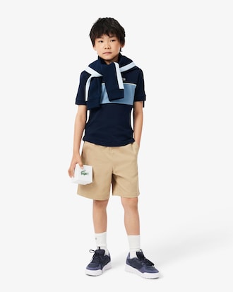 Polo de petit piqu&eacute; con franja en contraste