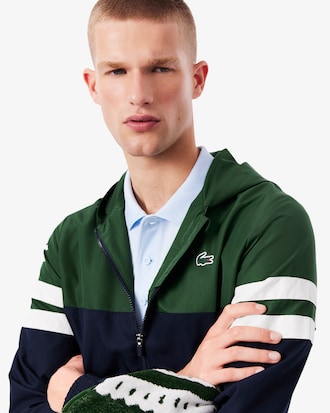 Chaqueta de tenis con capucha hidr&oacute;fuga