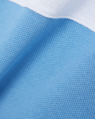 Polo de petit piqu&eacute; con bloques de color