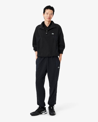 Pantal&oacute;n de ch&aacute;ndal deportivo de dos tejidos