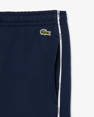 Short molleton de coton liserés griffés