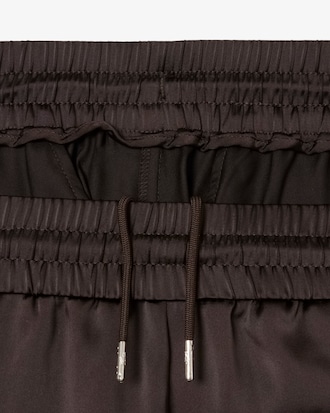 Pantalon de surv&ecirc;tement oversize satin&eacute;