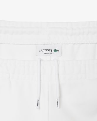 Pantalon de survêtement liserés griffés