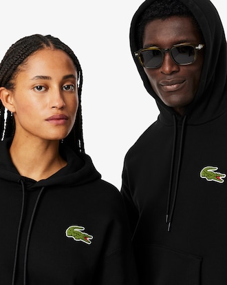 Sweatshirt à capuche loose fit avec badge
