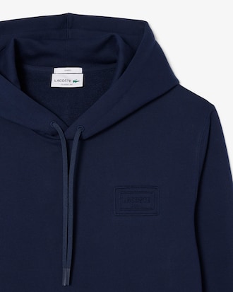 Sweatshirt &agrave; capuche marquage emboss&eacute;