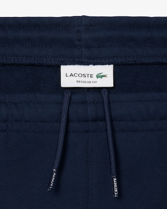 Short molleton de coton liserés griffés