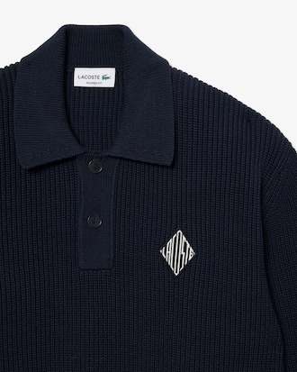 Pull col polo maille perl&eacute;e badge