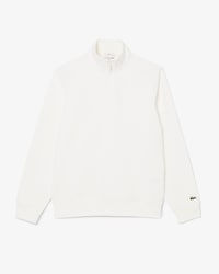 Sweatshirt col montant zipp&eacute; marquage emboss&eacute;