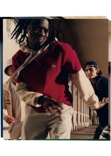 Classic burgundy polo shirt worn over a cream hoodie by Salif Gueye