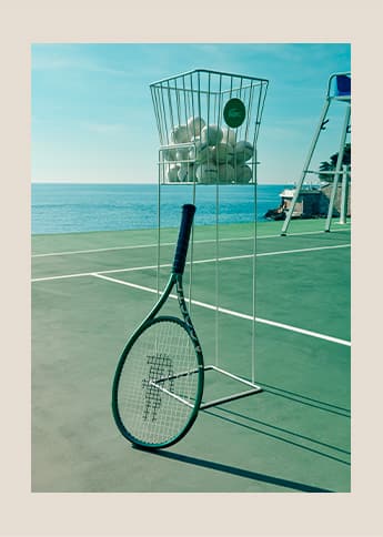 Lacoste L23 racket on tennis court