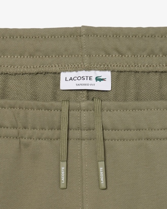 Trainingshose mit Logostreifen