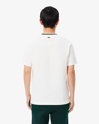 Franz&ouml;sisches T-Shirt mit Streifen und Badge-Akzent