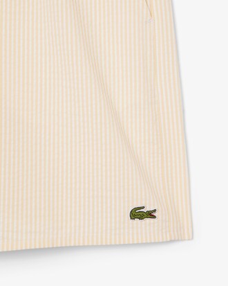 Short de ba&ntilde;o texturizado de rayas de largo medio