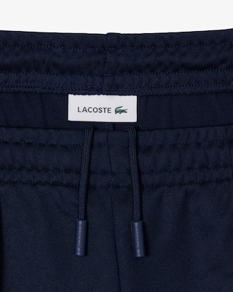 Pantal&oacute;n de ch&aacute;ndal plisado y acampanado