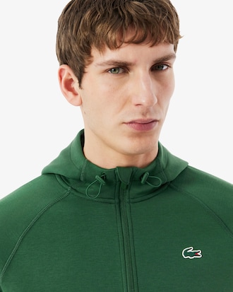 Sudadera deportiva el&aacute;stica con capucha y cremallera