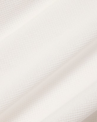 Polo de petit piqu&eacute; con insignia