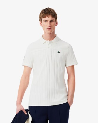 Polo de tenis cl&aacute;sico con insignia decorativa Ultra Dry