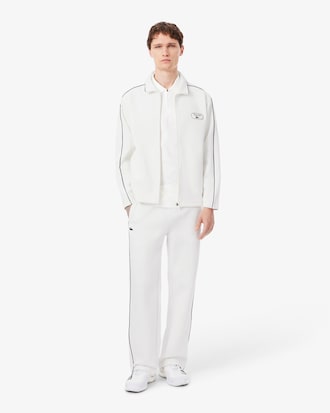 Polo de tenis cl&aacute;sico con insignia decorativa Ultra Dry