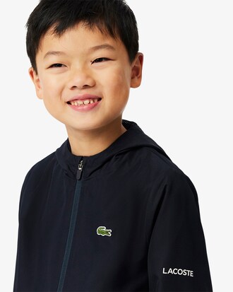 Chaqueta deportiva con capucha y cremallera
