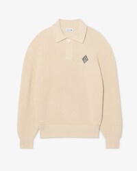 Jersey con cuello polo de punto de canal&eacute; perlado con insignia en contraste