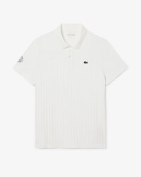 Polo de tenis cl&aacute;sico con insignia decorativa Ultra Dry