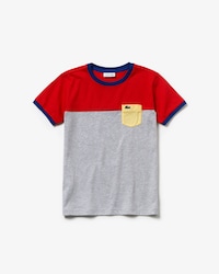 Camiseta de niño en algodón color block con cuello redondo y bolsillo a contraste