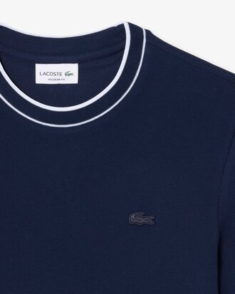 Camiseta de piqu&eacute; el&aacute;stico con cuello de rayas
