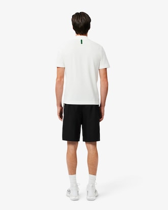 Pantalón corto de rayas con logotipo deportivo