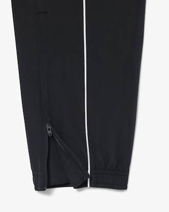 Pantal&oacute;n de ch&aacute;ndal deportivo hidr&oacute;fugo con ribete en contraste