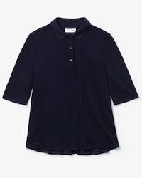 Polo de mujer Lacoste en petit piqu&eacute; con espalda plisada