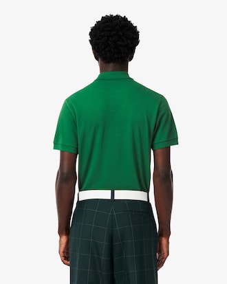 Polo de golf de minipiqu&eacute; el&aacute;stico con insignia