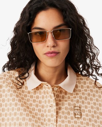 Polo oversize con estampado de tenis