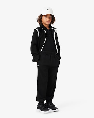 Pantal&oacute;n de ch&aacute;ndal deportivo con raya decorativa