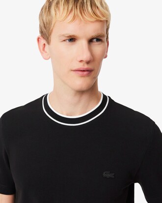 Camiseta de piqu&eacute; el&aacute;stico con cuello de rayas