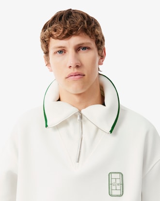 Sudadera de cuello alto con cremallera de corte amplio con insignia