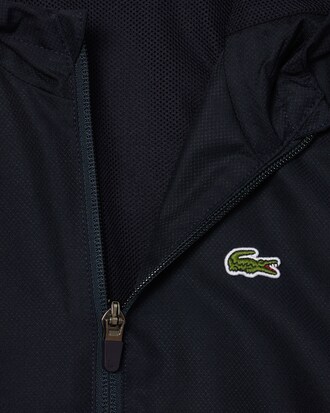 Chaqueta deportiva con capucha y cremallera