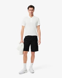 Pantalón corto de rayas con logotipo deportivo