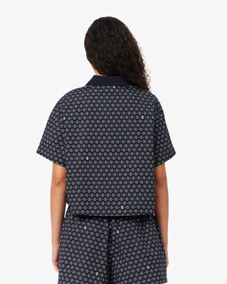 Polo oversize con estampado de tenis