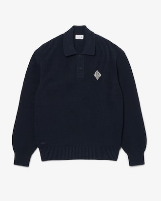 Jersey con cuello polo de punto de canal&eacute; perlado con insignia en contraste