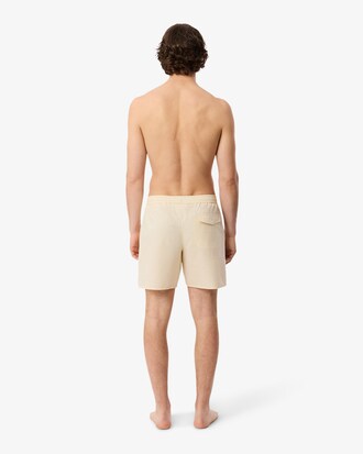 Short de ba&ntilde;o texturizado de rayas de largo medio