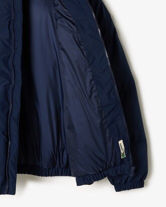 Chaqueta acolchada con capucha y cocodrilo bordado