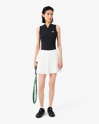 Polo de tenis el&aacute;stico sin mangas de dos tejidos