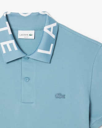 Polo de corte ajustado con detalles de marca en jacquard